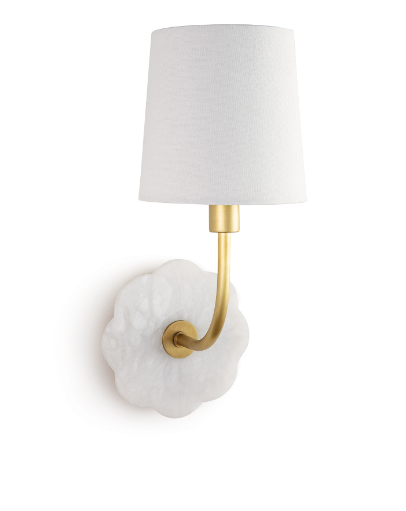 Brass and alabaster wall sconce with white shade on white wall.