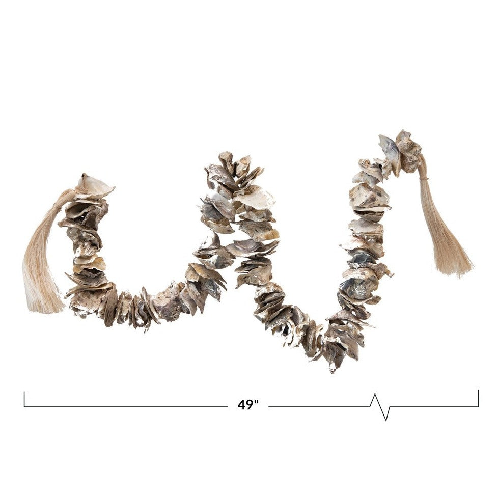 oyster shell decor garland on white background with size measurement of 49"