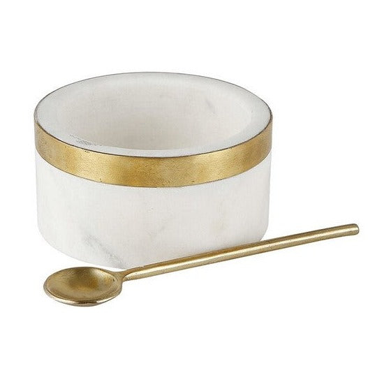 marble bowl with brass spoon on white background