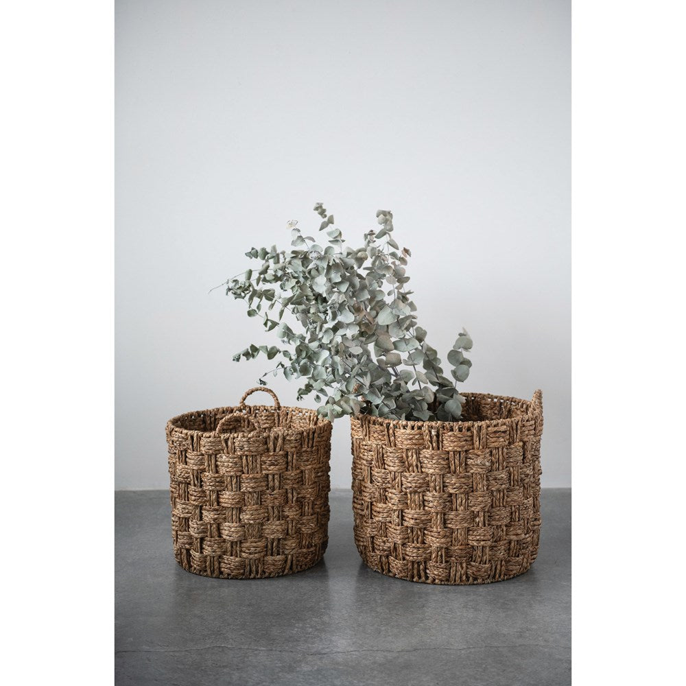seagrass and metal basket large and medium holding eucalyptus