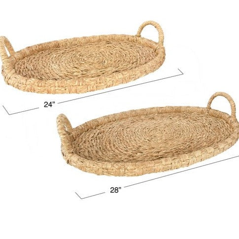 seagrass and rattan tray with handles on white background. Measurements are on labeled at small for 24" and large at 28"